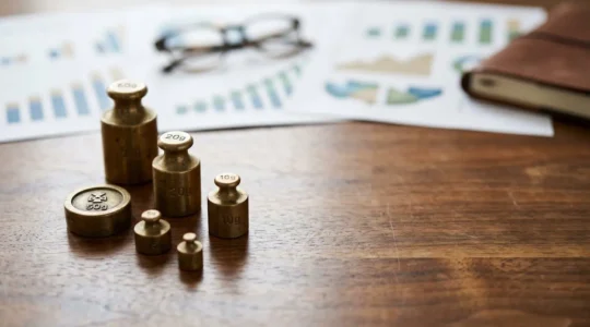 Professional editorial photograph showing financial portfolio balance and quarterly rebalancing strategy concept